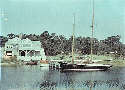 Lyn Hart, aboard the Stormy Petral with Howdy Eddy in the background 